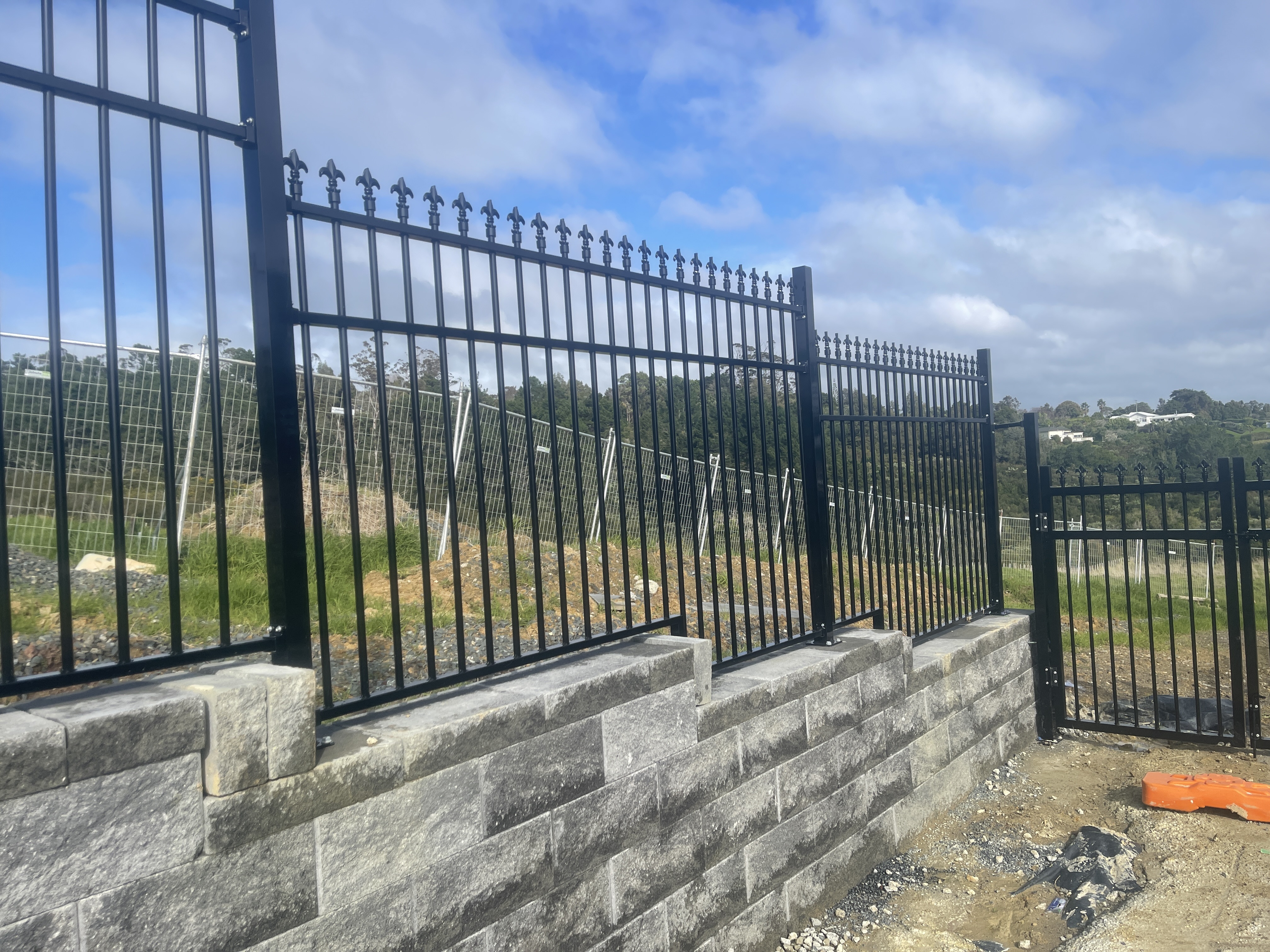 Aluminium Barrier fence on top of keystone wall for fall protection with PS1 installed in Flat Bush . coucil approved .